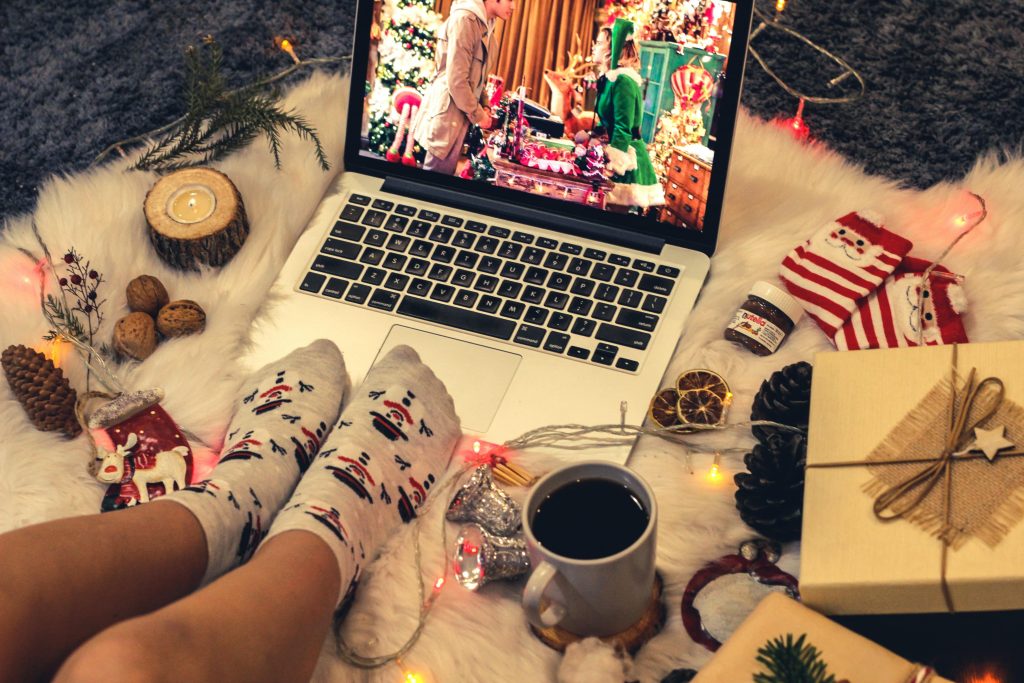christmas pen pal movie on the laptop with christmas decoration