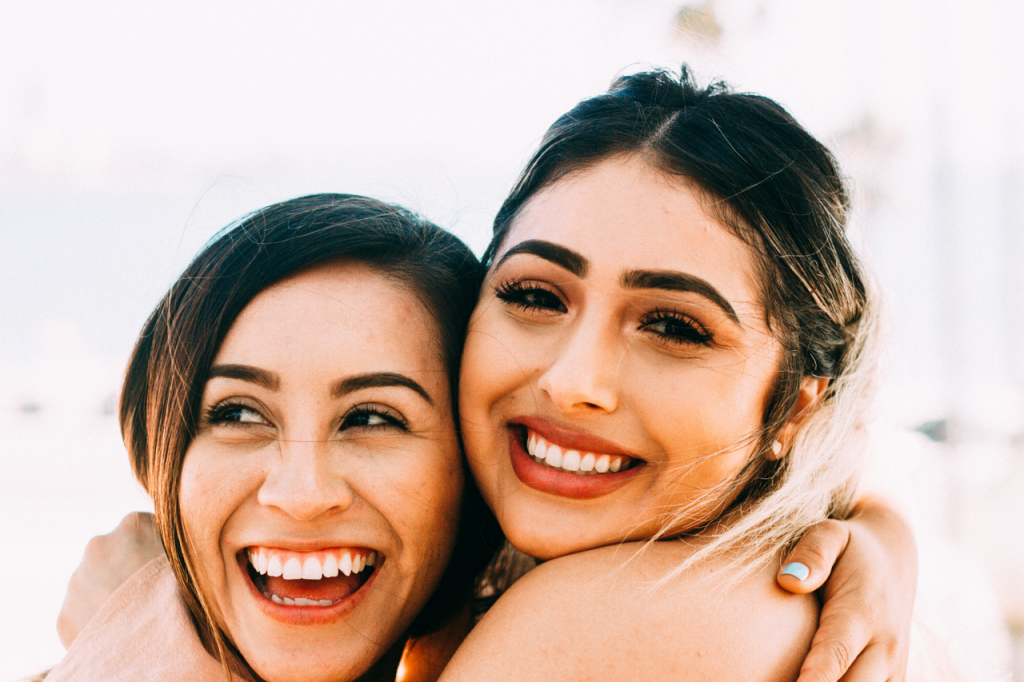 Two friends are hugging and meet for friendship day